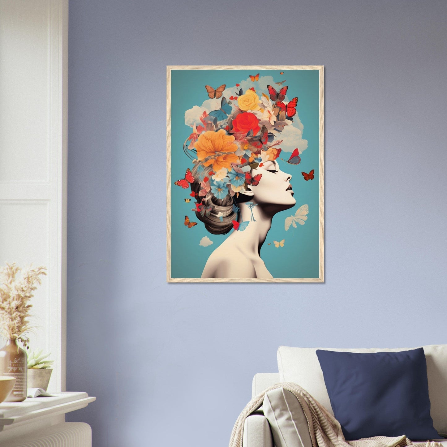 Framed artwork depicting a woman’s profile with colorful butterflies and flowers emerging from her head.