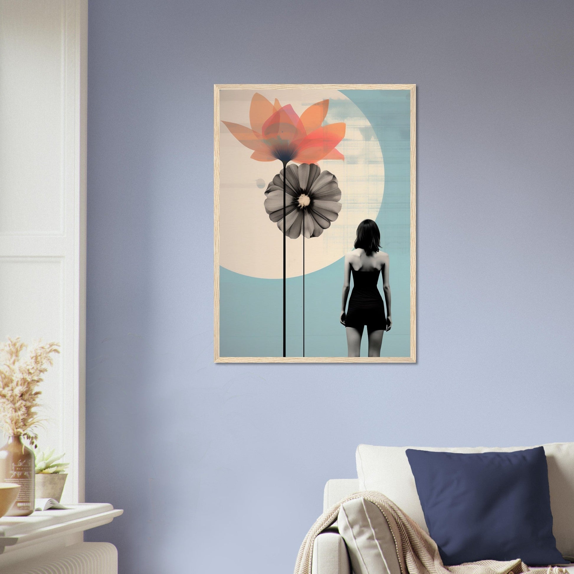 Framed artwork depicting a silhouette of a person standing next to stylized flowers against a circular background.