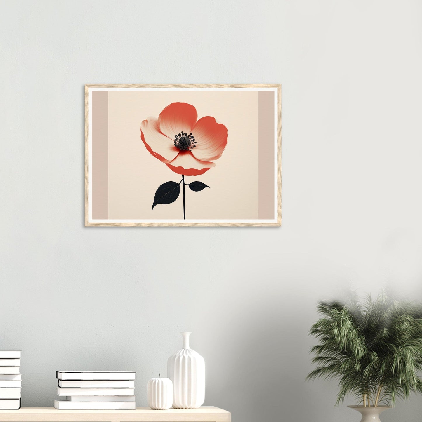 Framed artwork depicting a single red poppy flower with black center and stem against a light background.