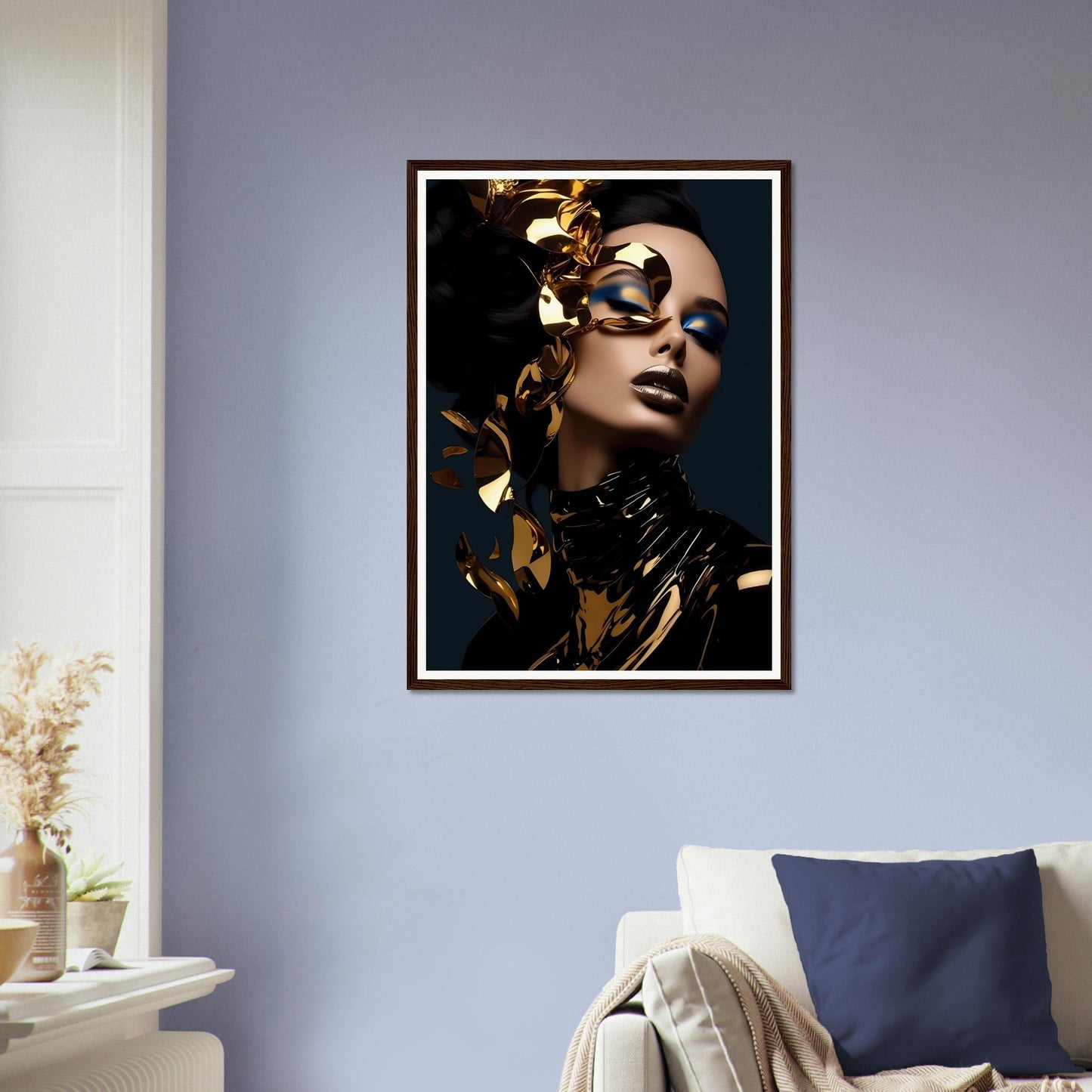 Framed portrait of a person with gold leaf accents and dramatic makeup against a dark background.