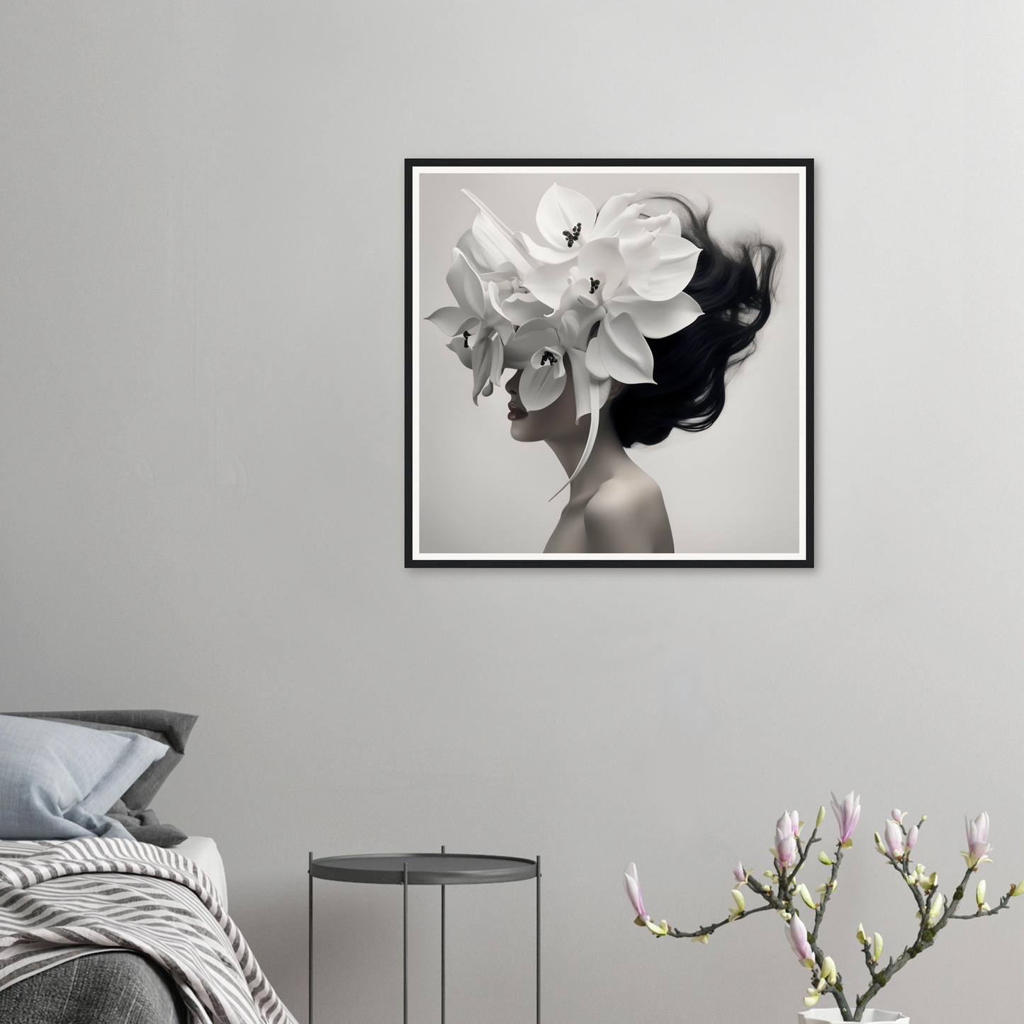 Framed black and white portrait of a figure with a floral headdress.