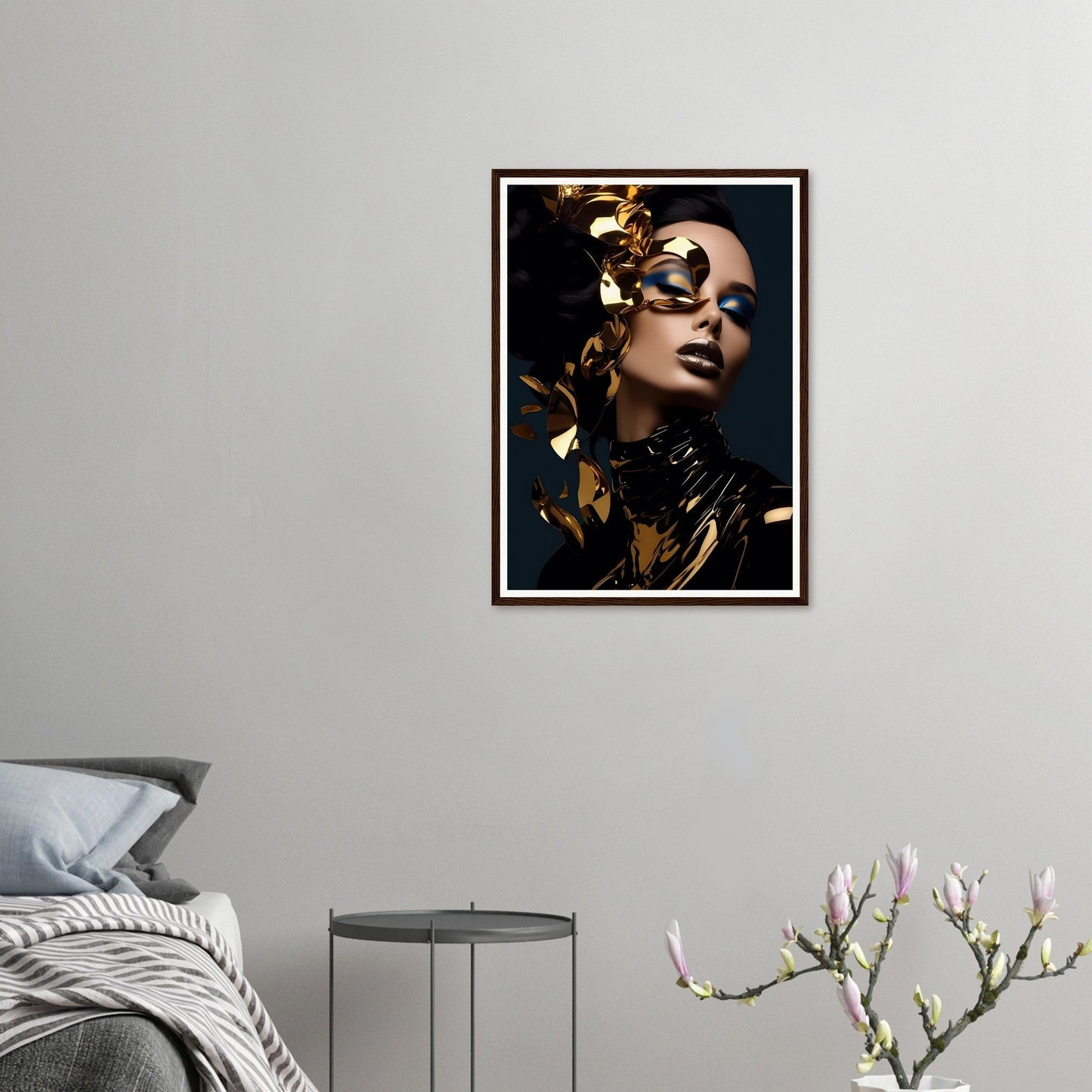 Framed portrait of a person with gold leaf accents on their face and dramatic makeup.