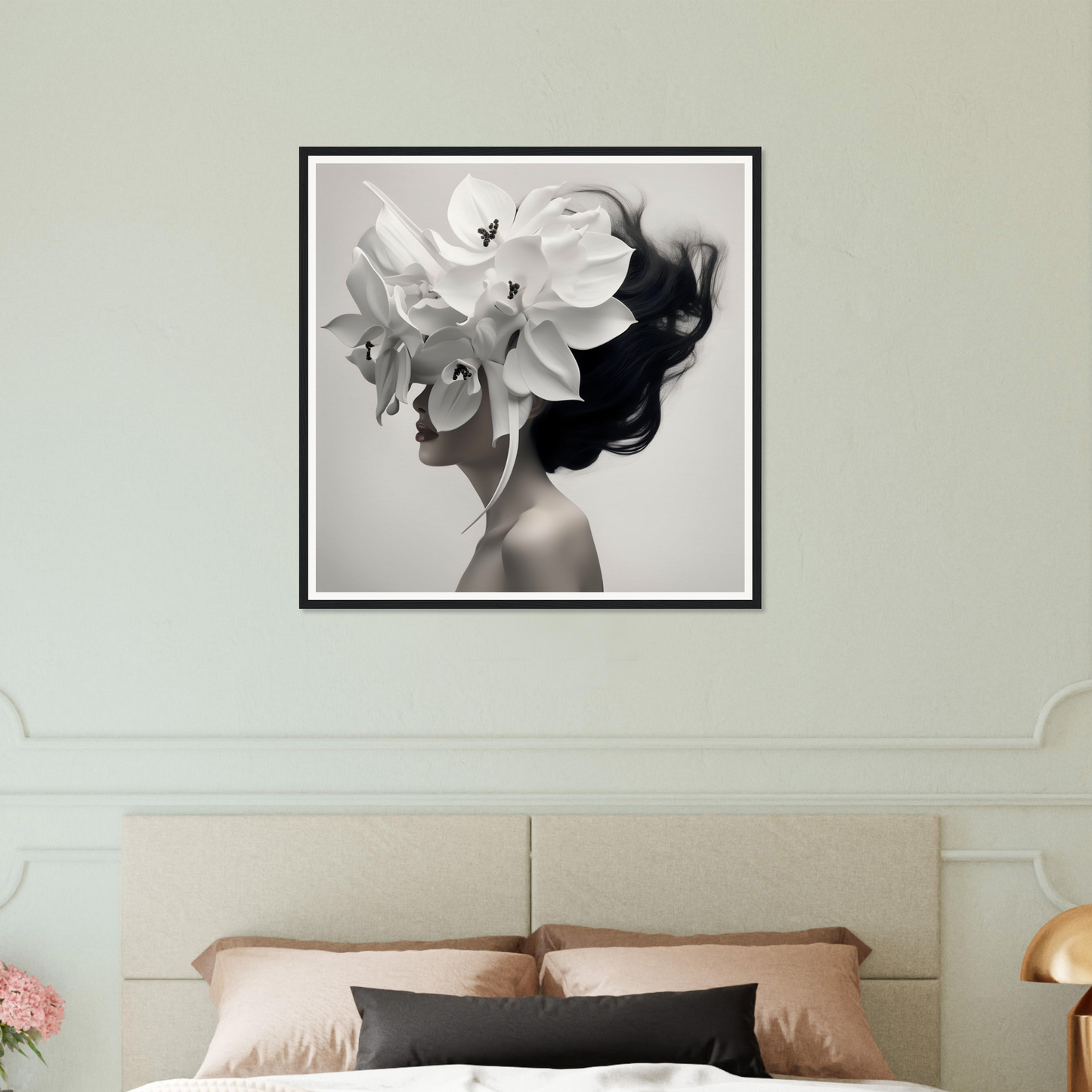 Black and white framed artwork depicting a figure with a large floral headdress.