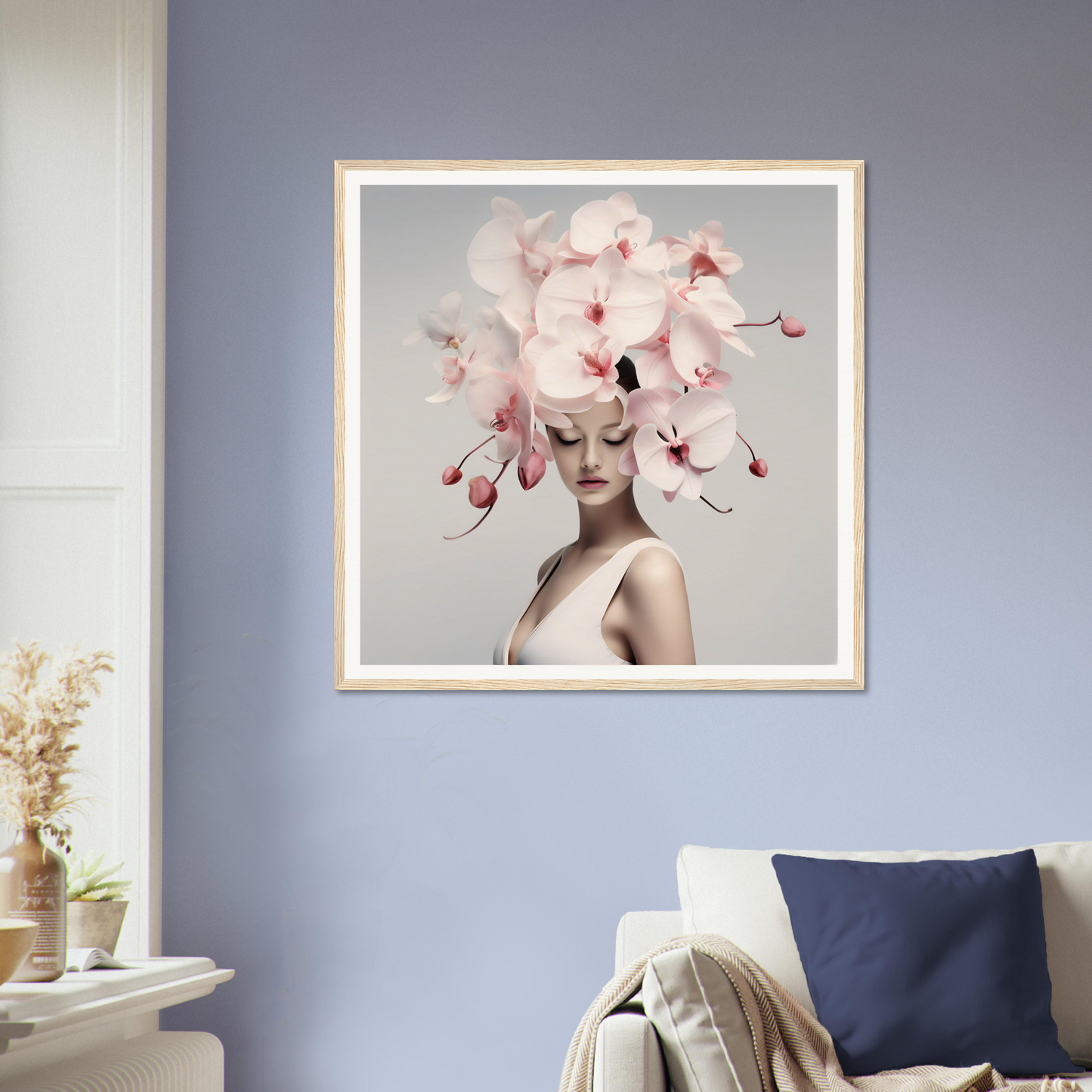 Framed artwork featuring a figure wearing an elaborate floral headdress.