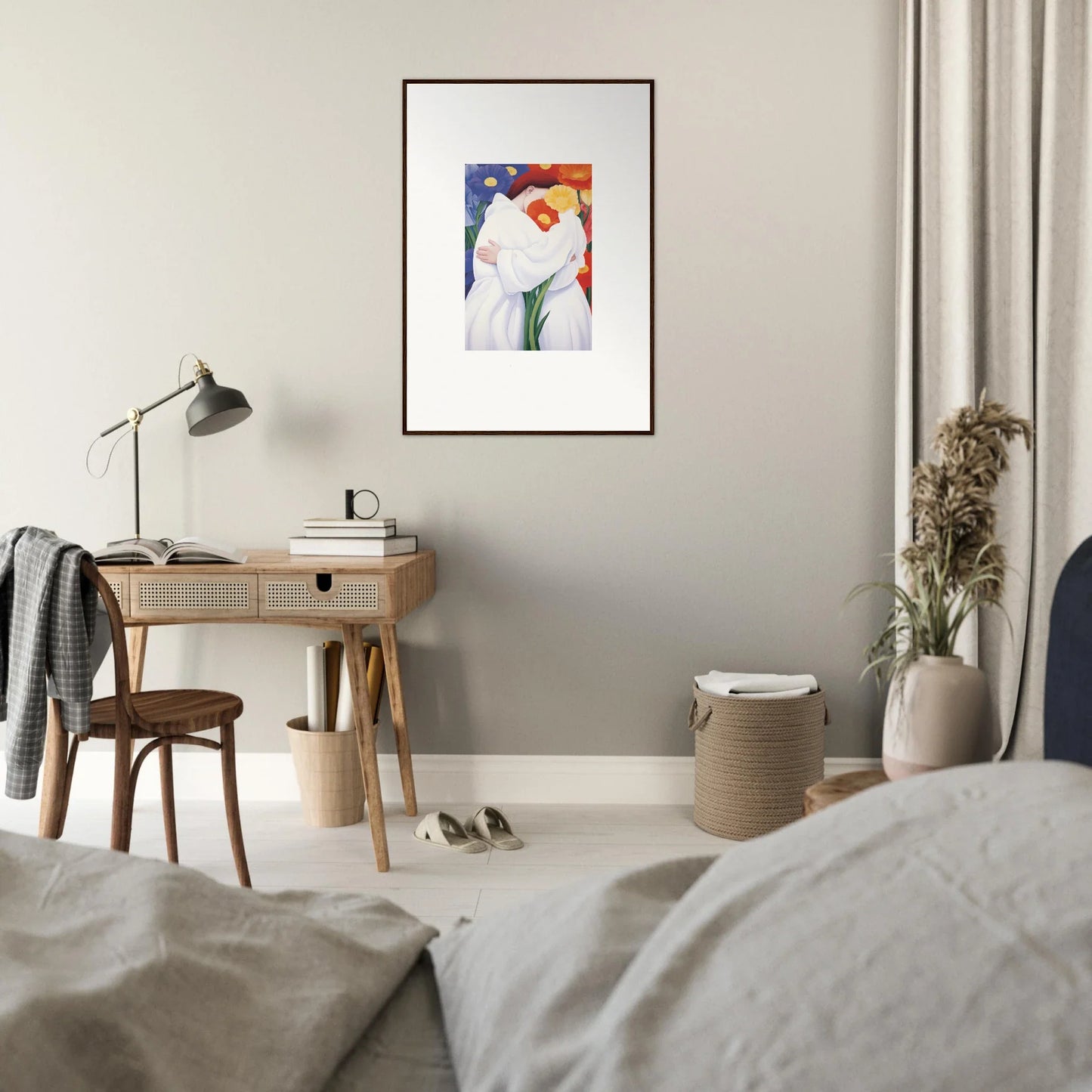 Framed wall art of colorful shapes with a white figure for vibrant room decor