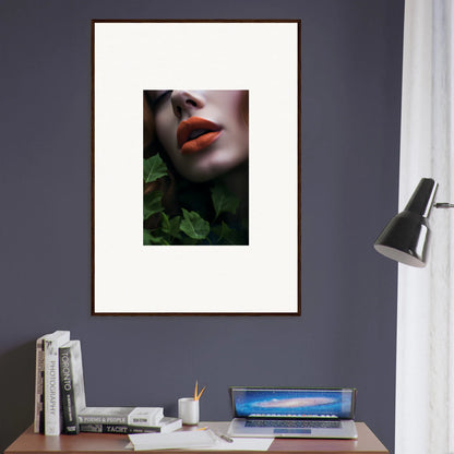 Framed wall art of red lips and pale skin amidst a leaf symphony background