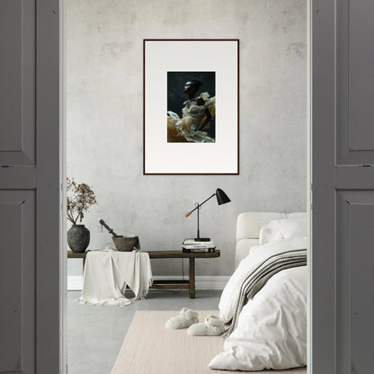 Framed artwork depicting a dark, moody scene hanging on a light-colored wall.