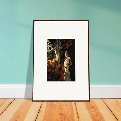 Framed artwork depicting a figure standing next to a deer in a forest setting.