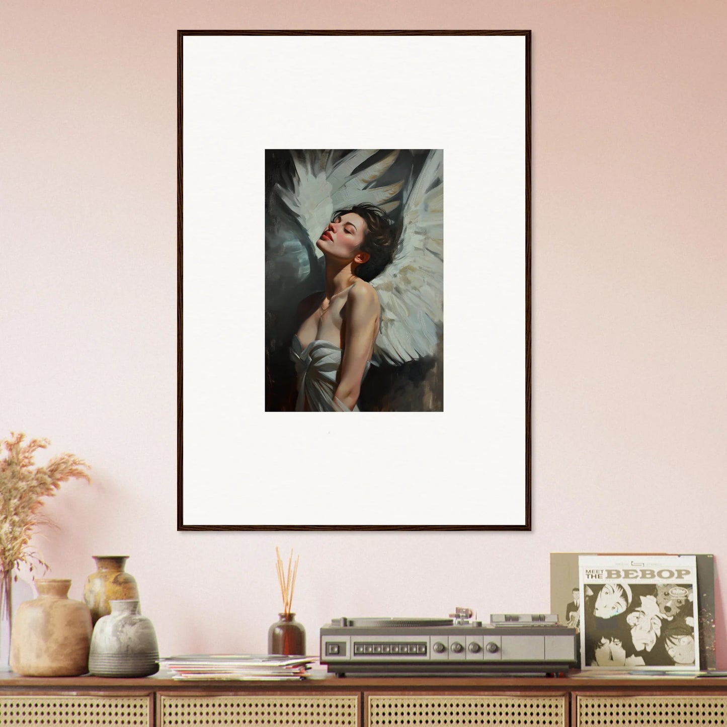 Framed wall art of a figure with white wings showcasing feathered elegance for room decor