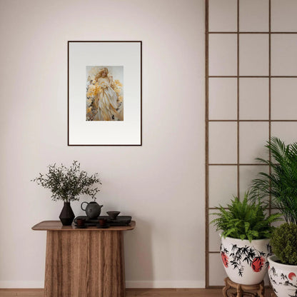 Framed wall art of a figure in light clothing holding an object, perfect for Blossom Sway room decor