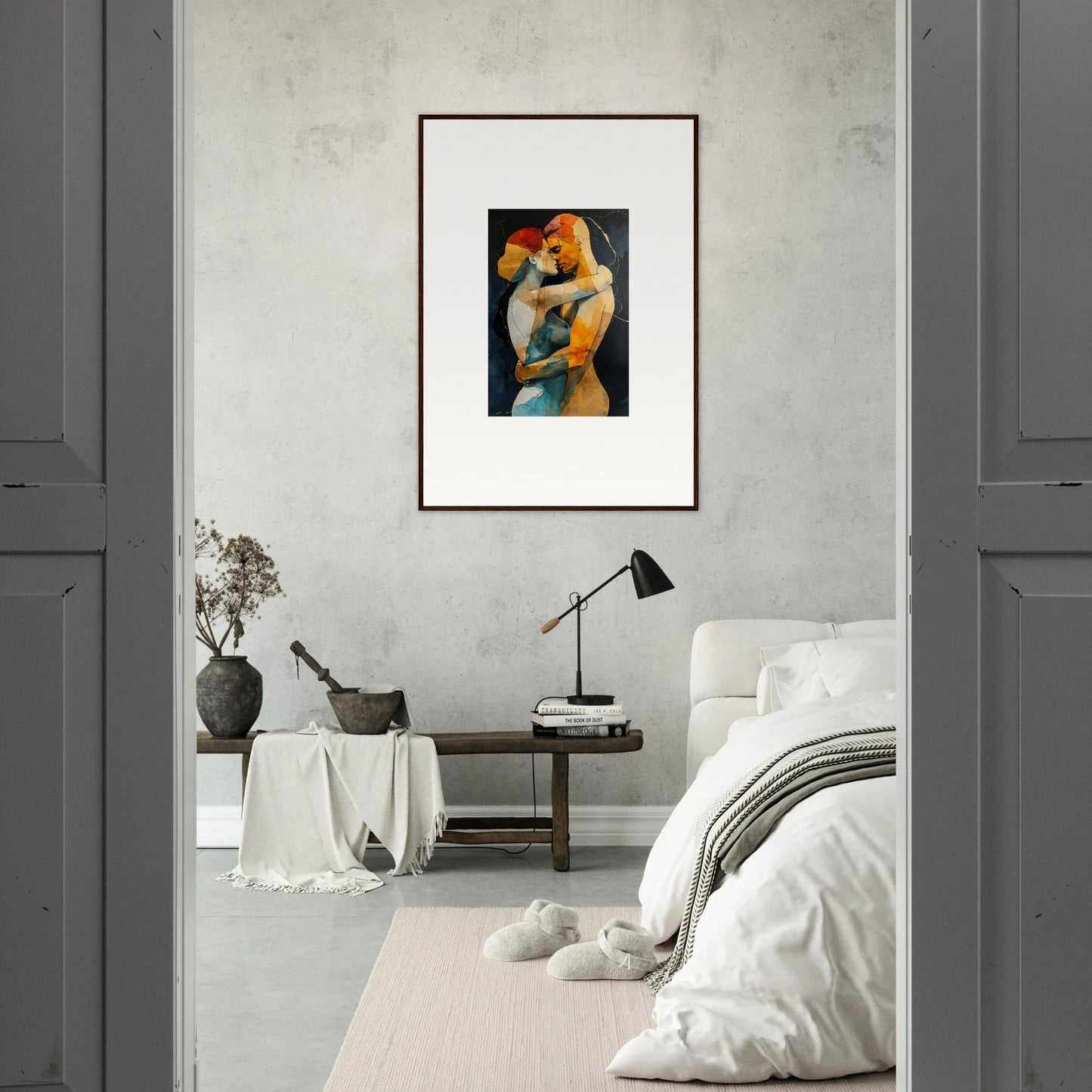 Framed wall art of an intimate embrace waves between two figures in warm tones