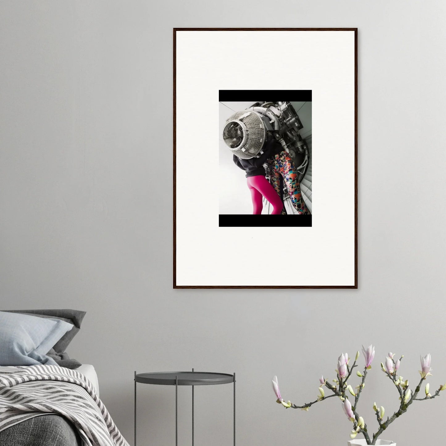 Framed wall art of an astronaut suit with pink legs, perfect for Magneto Embrace room decor