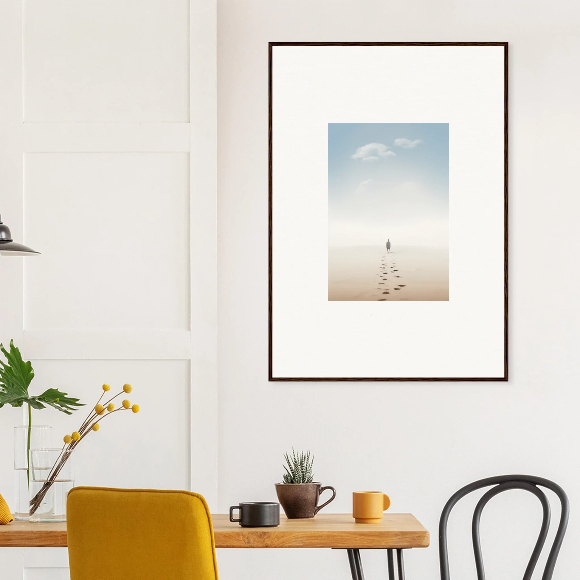 Framed wall art of a solitary figure on a beach represents entwined nostalgia