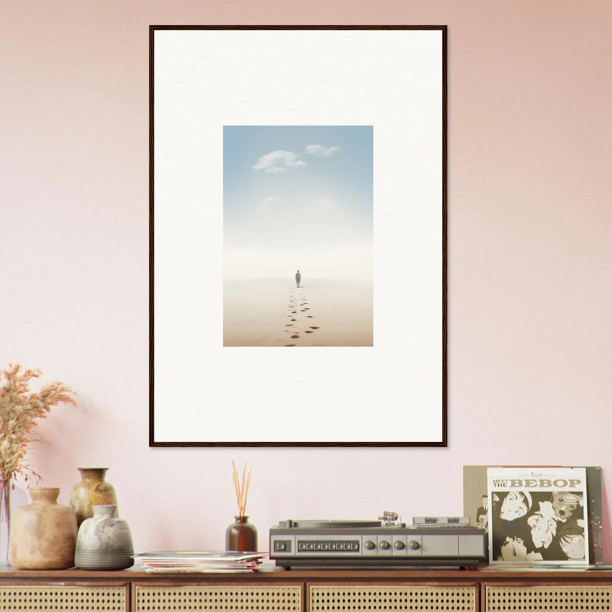 Framed wall art of a figure walking on barren land, embodying entwined nostalgia