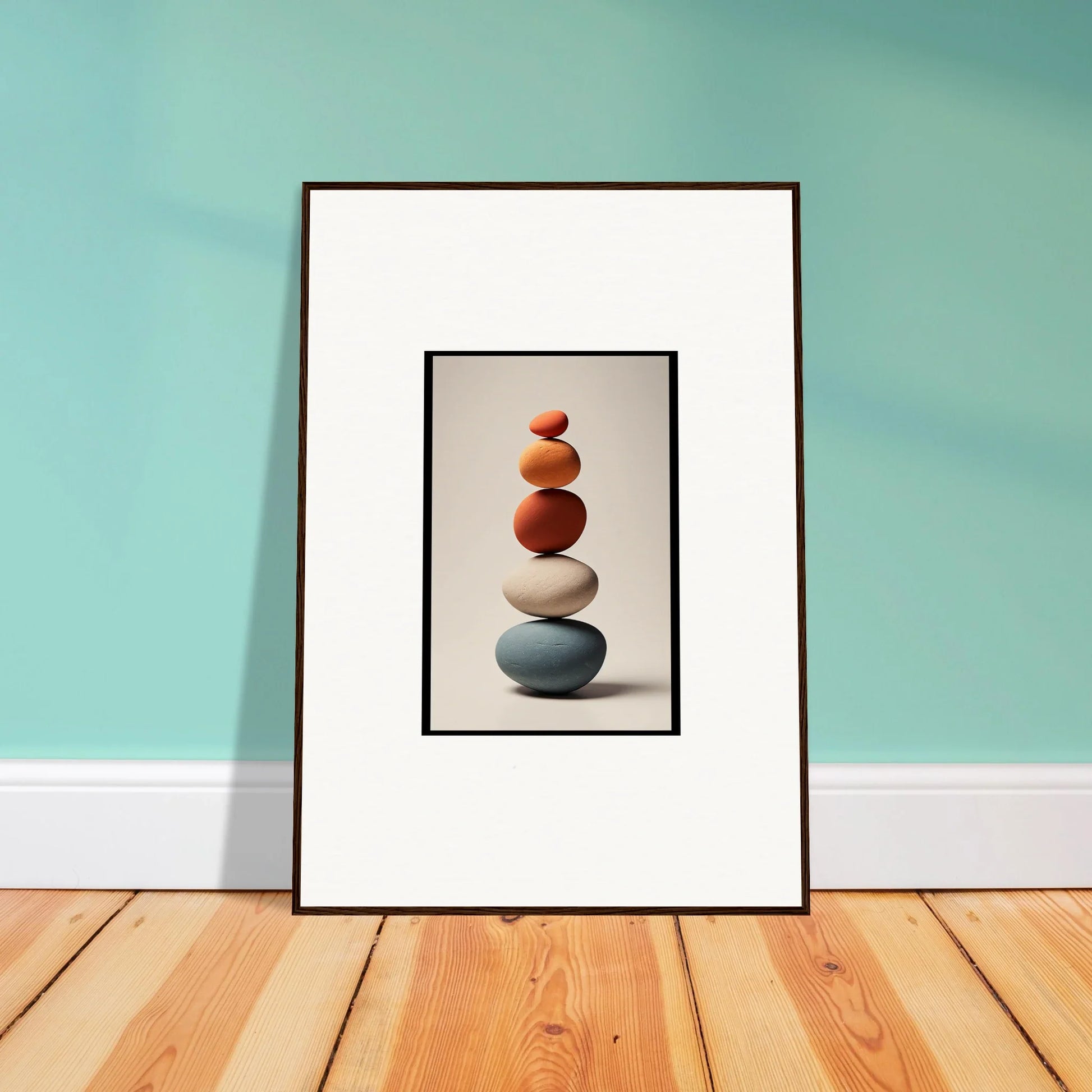 Framed wall art featuring a colorful stack of balanced stones for stylish room decor