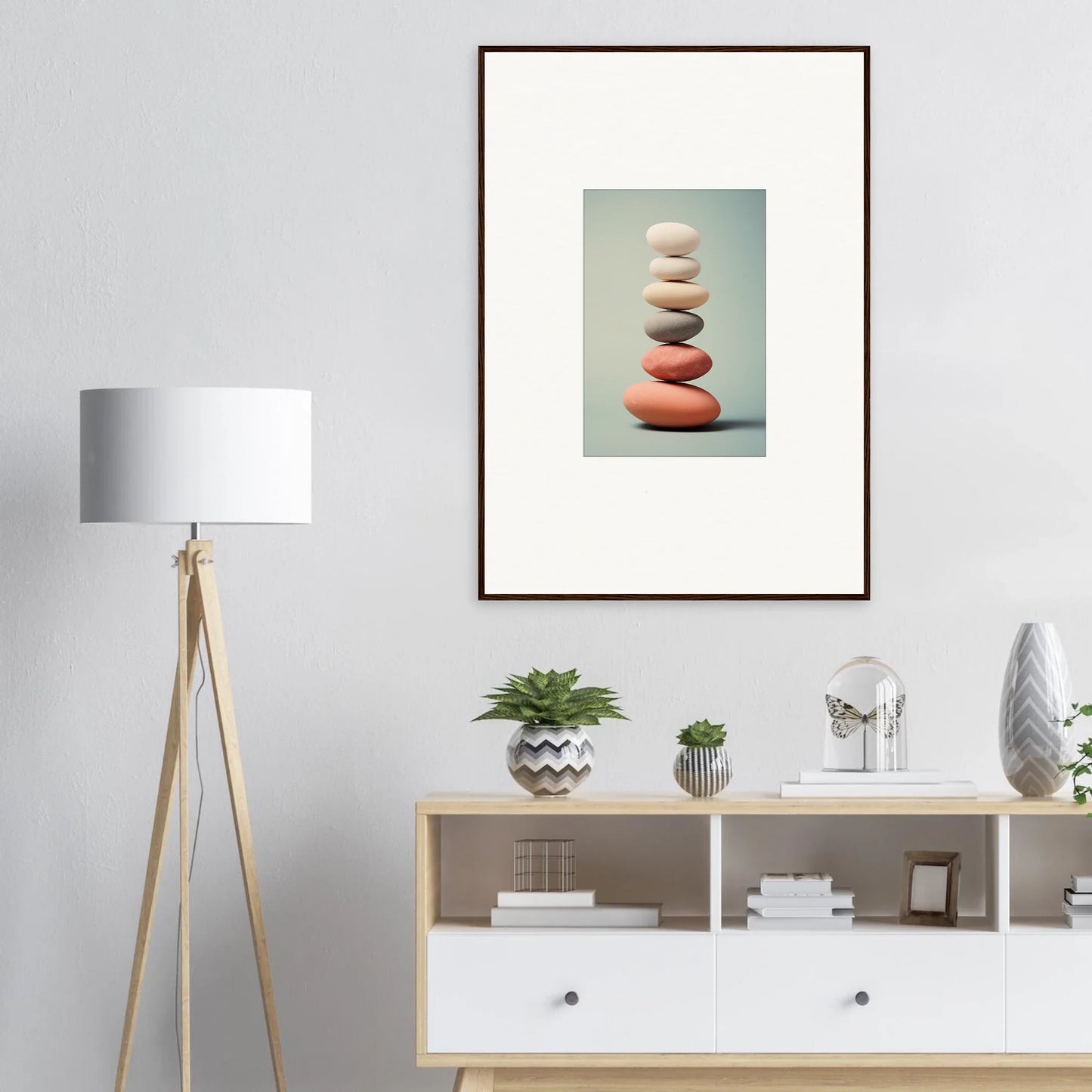 Framed wall art of balanced stones in muted colors for elegant room decor