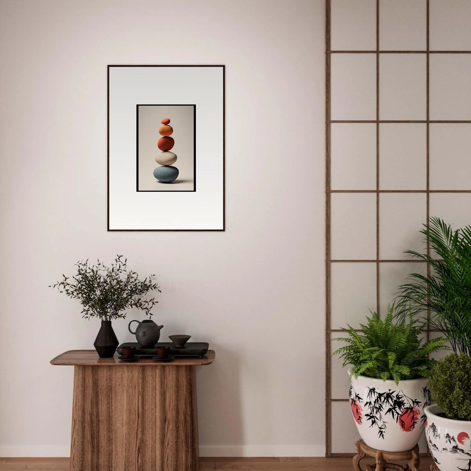 Framed wall art featuring stacked stones and a red object for serene room decor