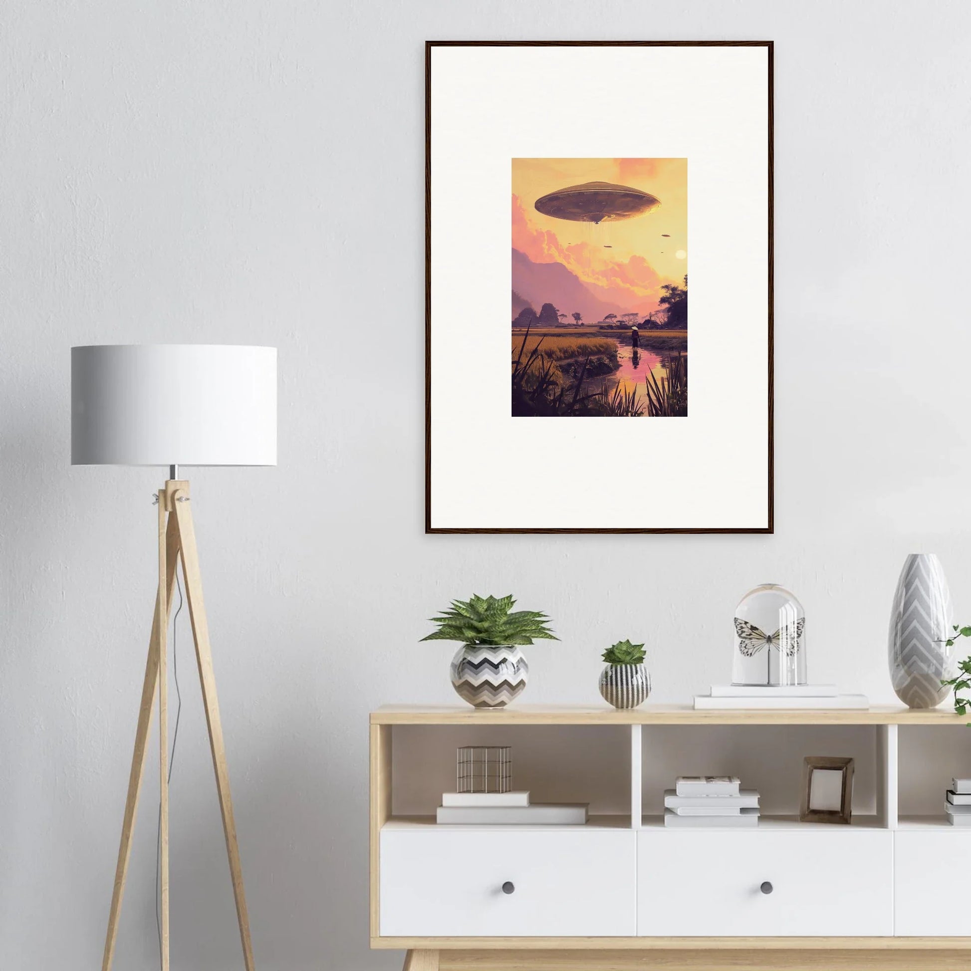 Framed wall art of a UFO over a sunset, perfect for unique room decor