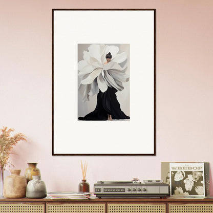 Framed wall art of white flower bloom atop black silhouette, perfect for room decor