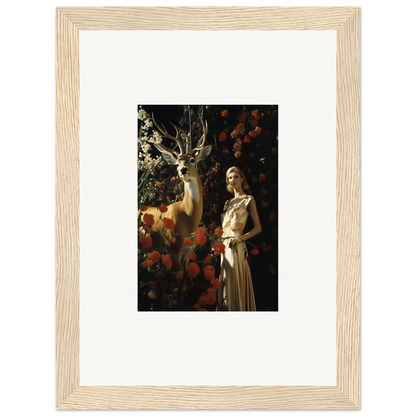 Framed artwork depicting a woman in an elegant dress standing next to a deer in a forest setting.