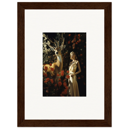 Framed artwork depicting a woman in a white dress standing next to a deer in a dark, floral setting.