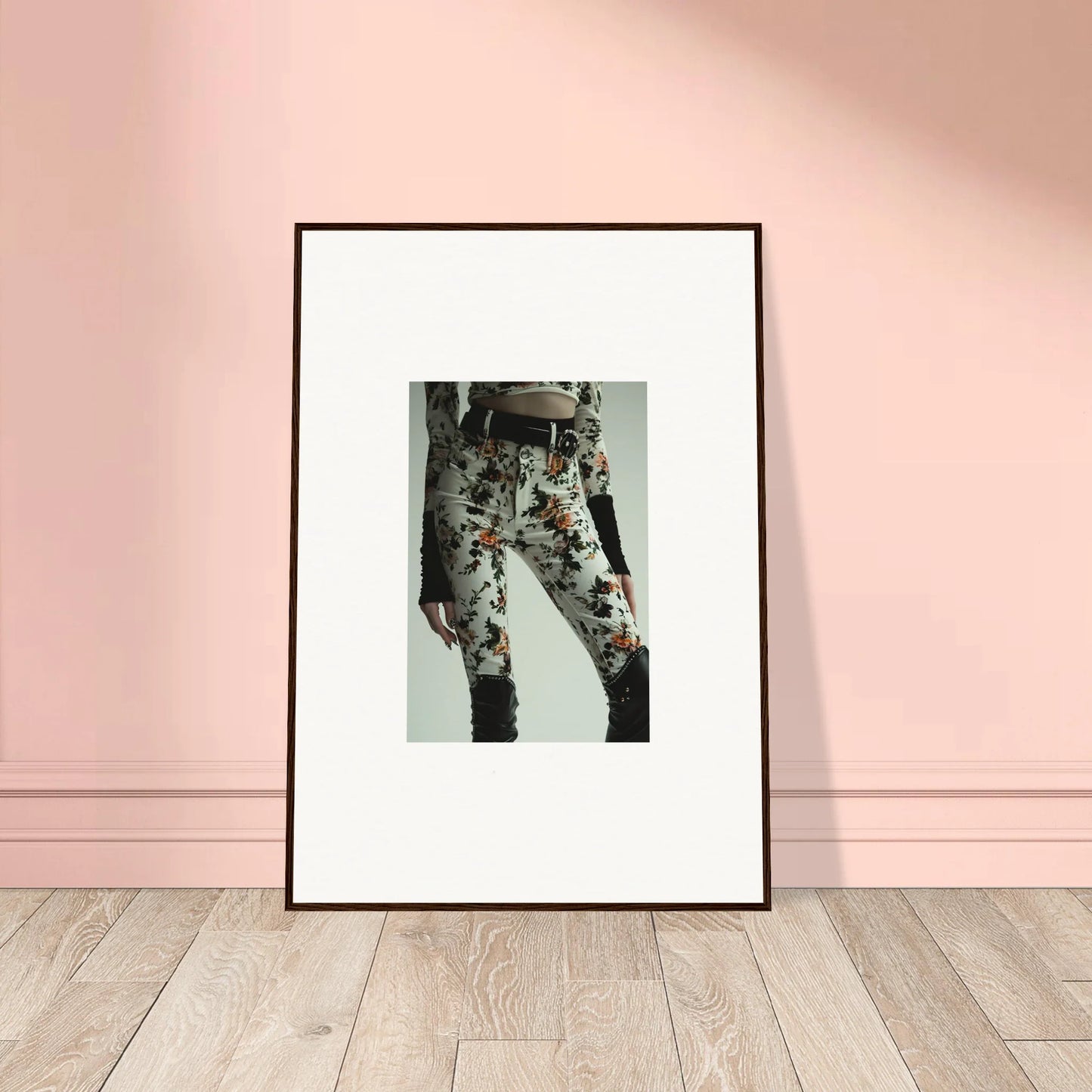 Framed black-and-white photograph of floral-patterned pants for stylish room decor