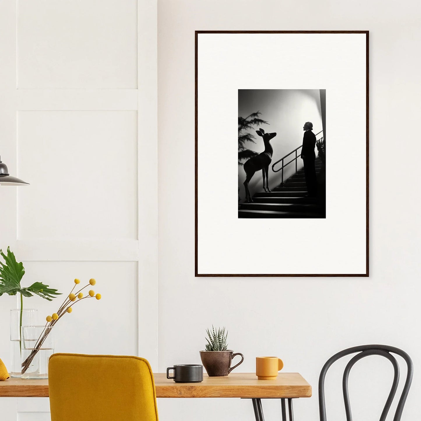 Framed black and white photograph showing a silhouetted figure ascending stairs.