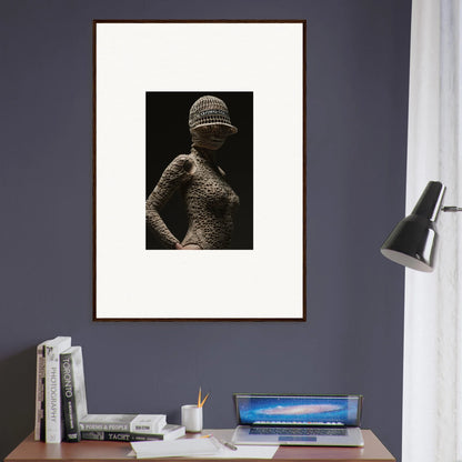 Framed black and white photograph of a textured female torso wearing a hat.