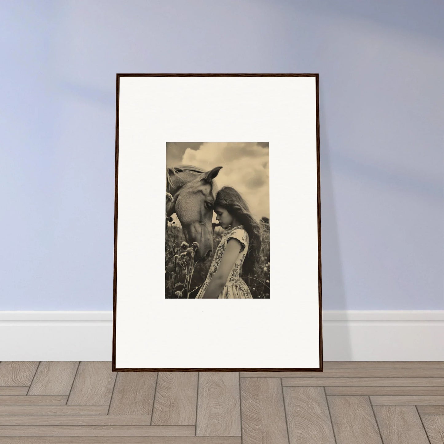 Framed black and white wall art of a person with long hair beside a horse for room decor