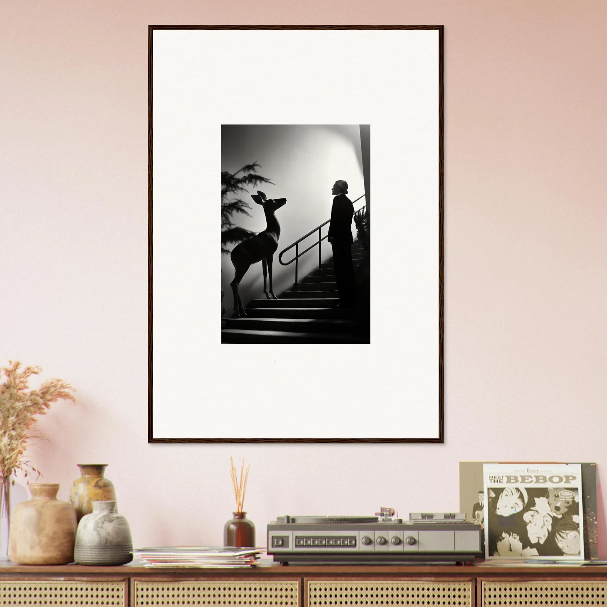 Framed black and white photograph showing silhouettes on stairs.