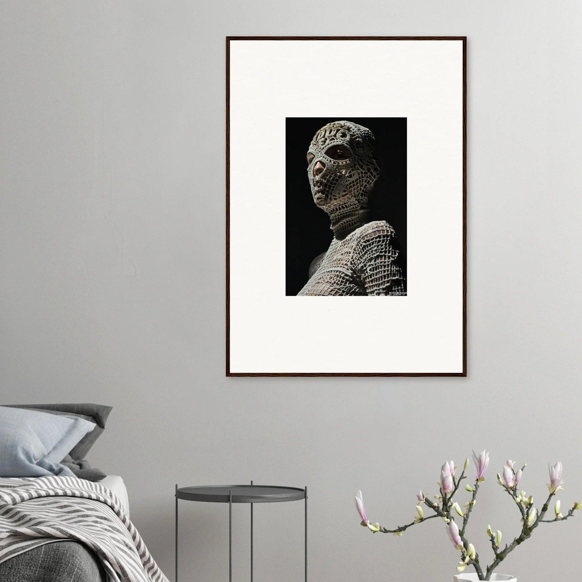 Framed black and white photograph of an ancient stone bust or sculpture.