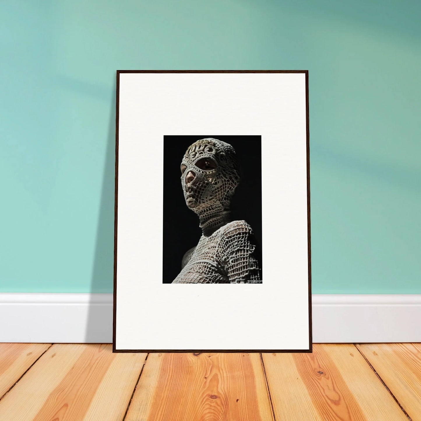 Framed black and white photograph of a sculptural bust.