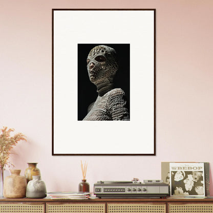 Framed black and white photograph of a sculptural bust with textured, grid-like surface.