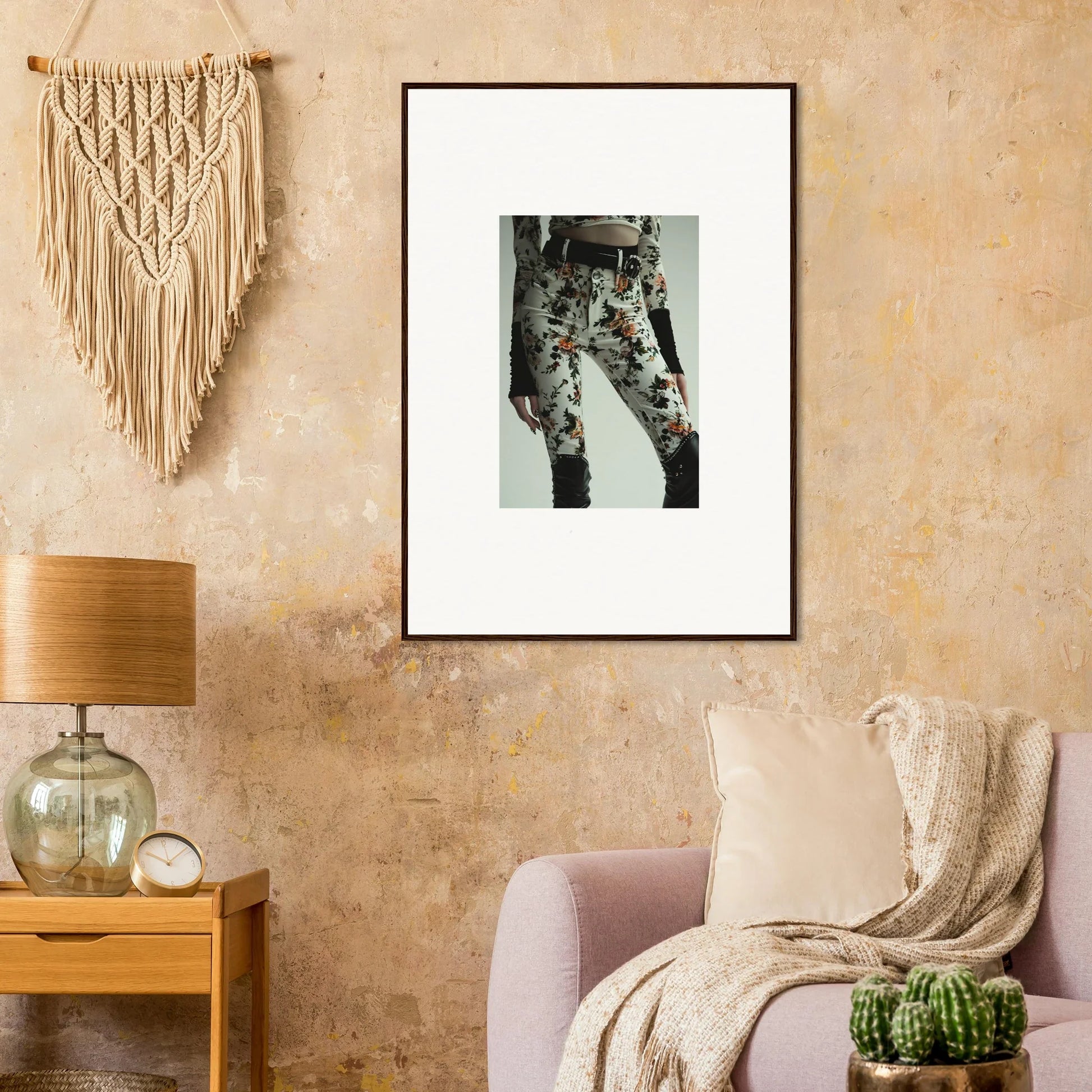 Framed black and white wall art of legs in floral pants for stylish room decor