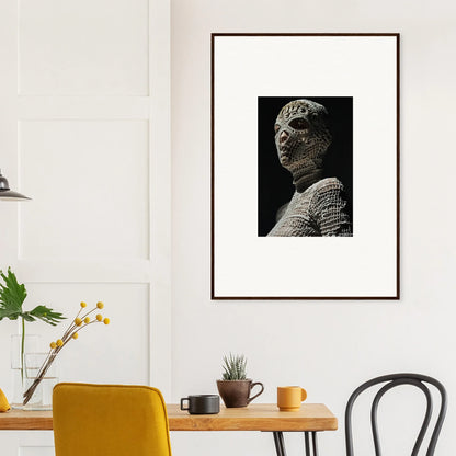 Framed black and white portrait of a textured, reptilian-looking humanoid figure.