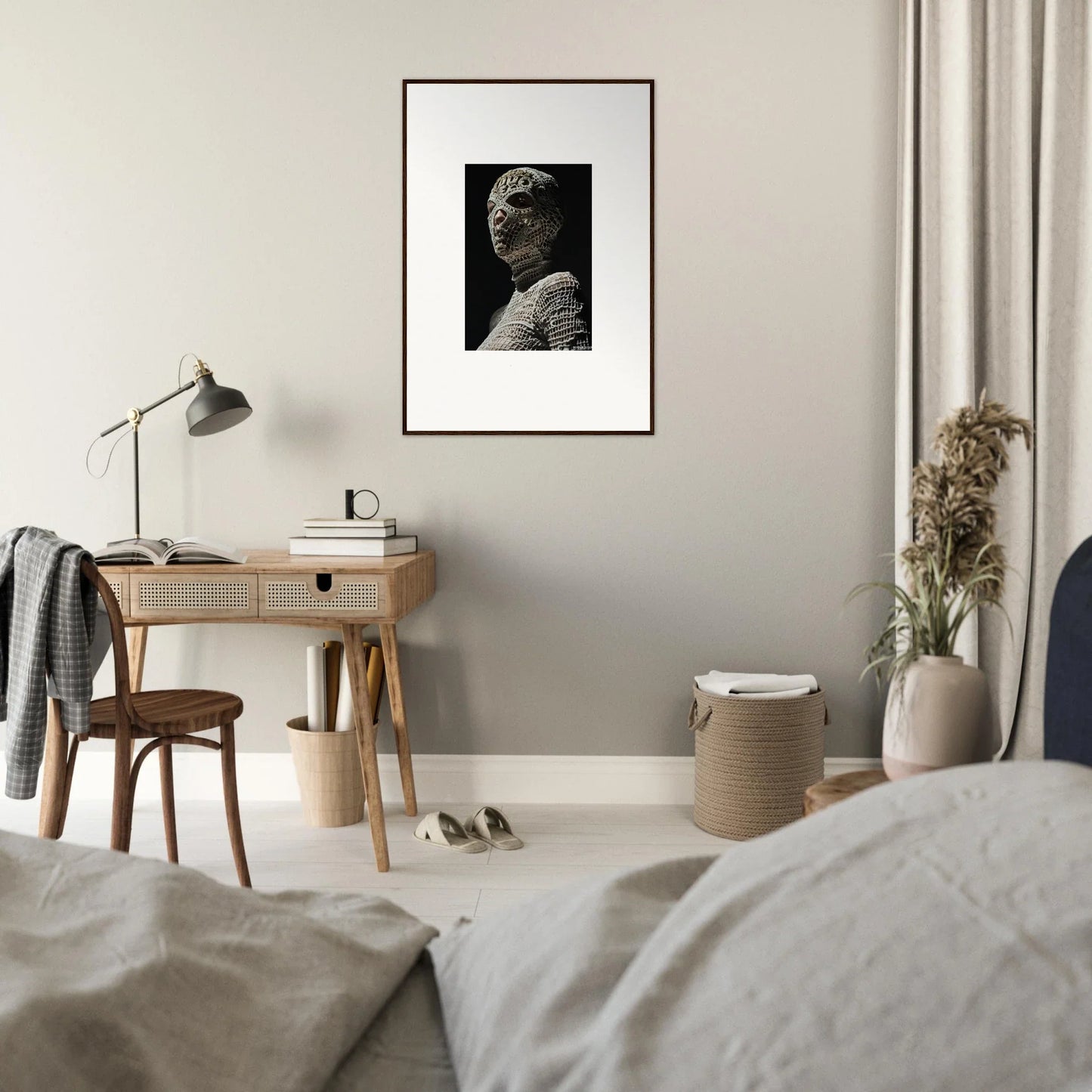 Framed black and white portrait photograph hanging on a wall.