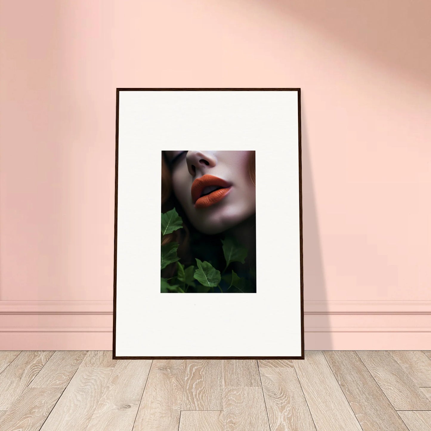 Framed wall art of bright red lips among green foliage in Leaf Symphony decor