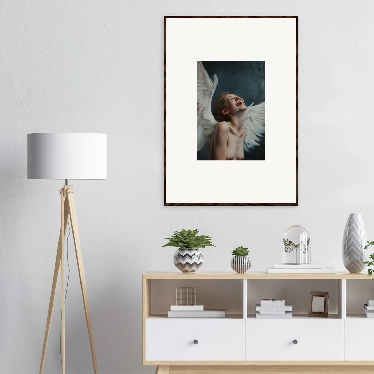 Framed wall art of a figure with angel wings, ideal for Wing Time room decor