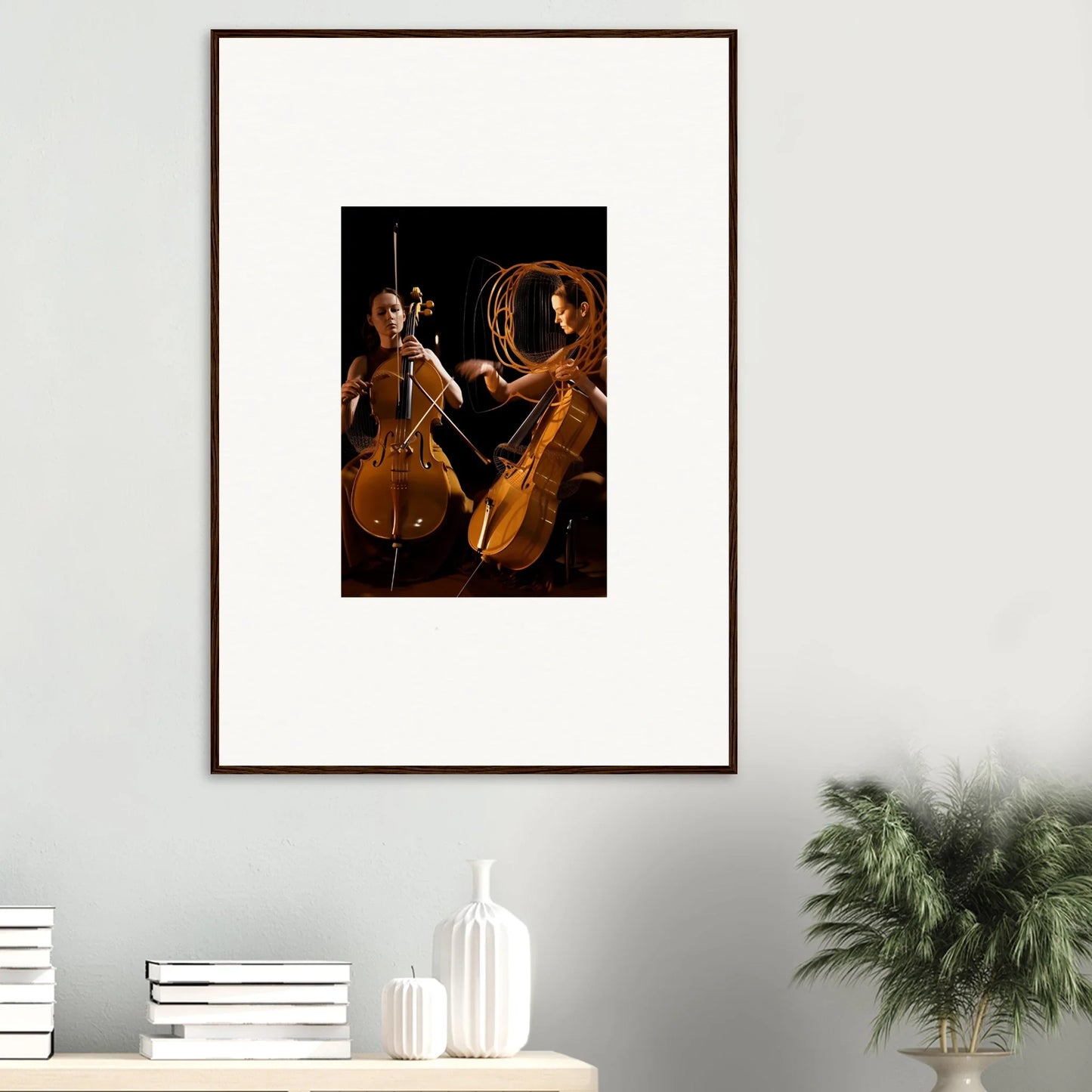 Framed wall art of musicians playing cellos in dramatic lighting for unique room decor