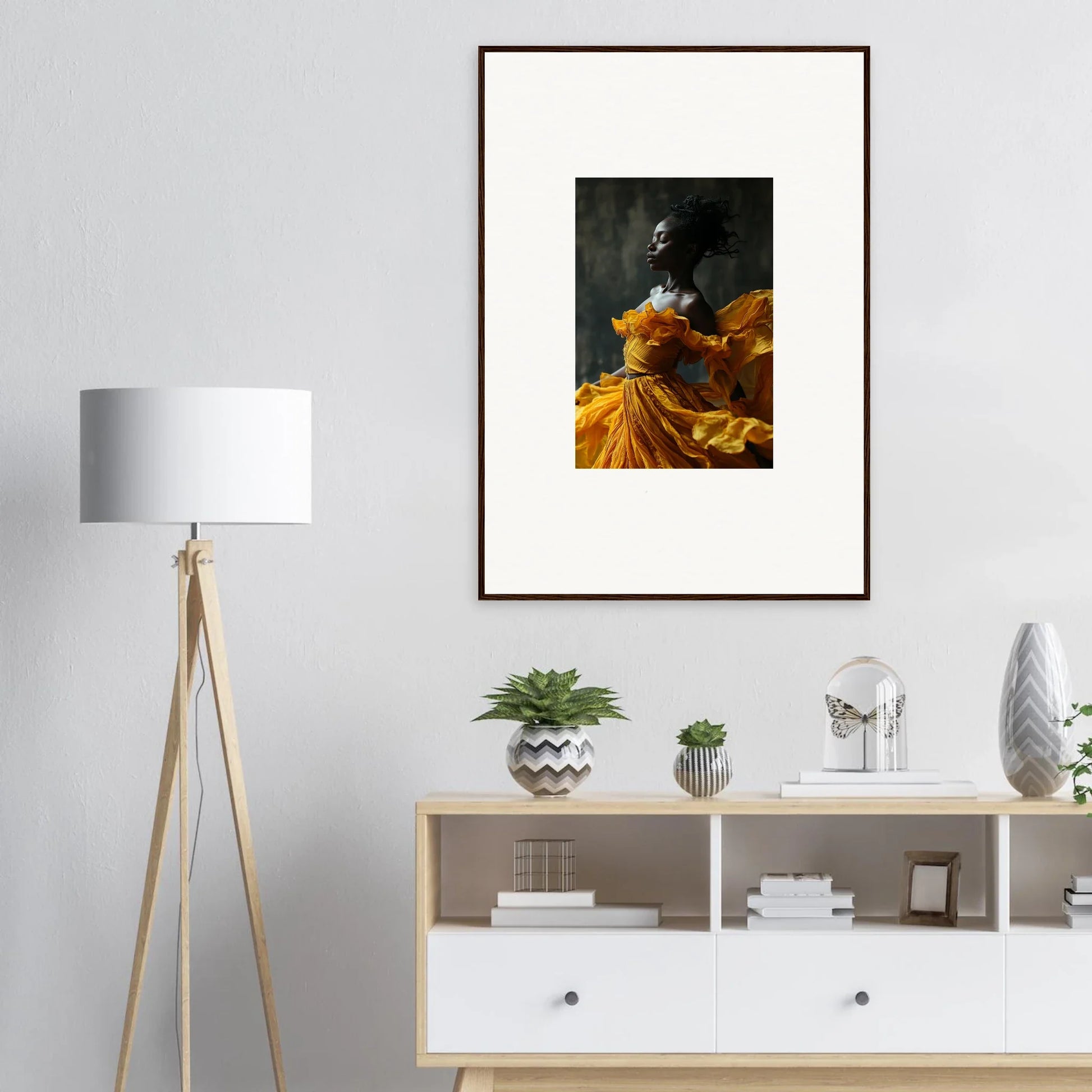 Framed wall art of a person in a yellow dress, perfect for sunlit whispers room decor