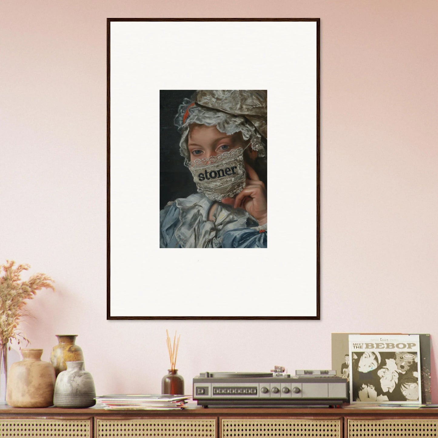 Framed wall art of a person in ornate headdress, exploring Metamorphose Bliss theme