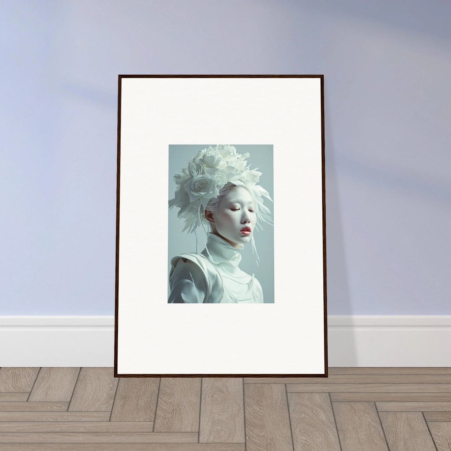 Framed wall art of a pale-skinned individual with white hair, a unique florid creature