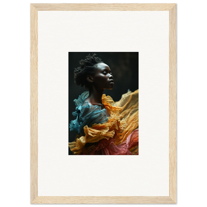 Framed portrait of a person surrounded by swirling colorful fabric.