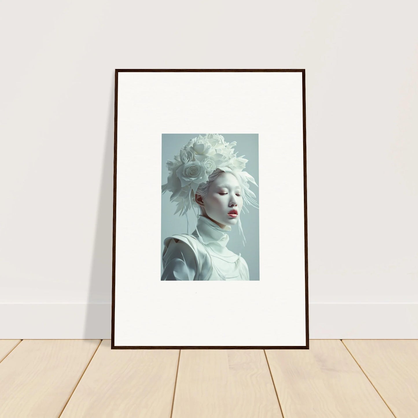 Framed wall art of a florid creature with white hair and red lips for stylish room decor