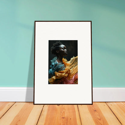 Framed portrait photograph of a person wearing colorful fabric.