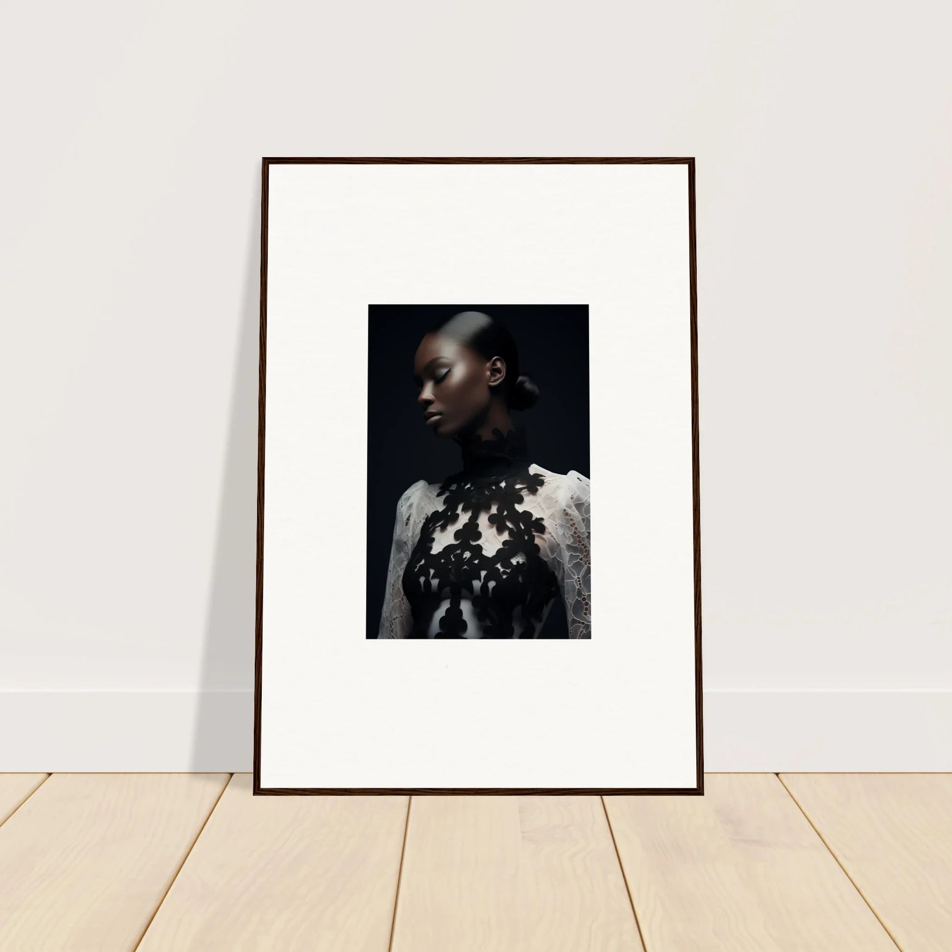 Framed wall art of a dark-skinned person in a white top with floral details