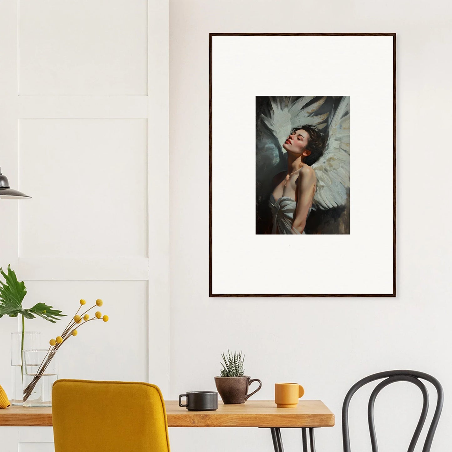 Framed wall art of a woman with white wings, showcasing feathered elegance in decor