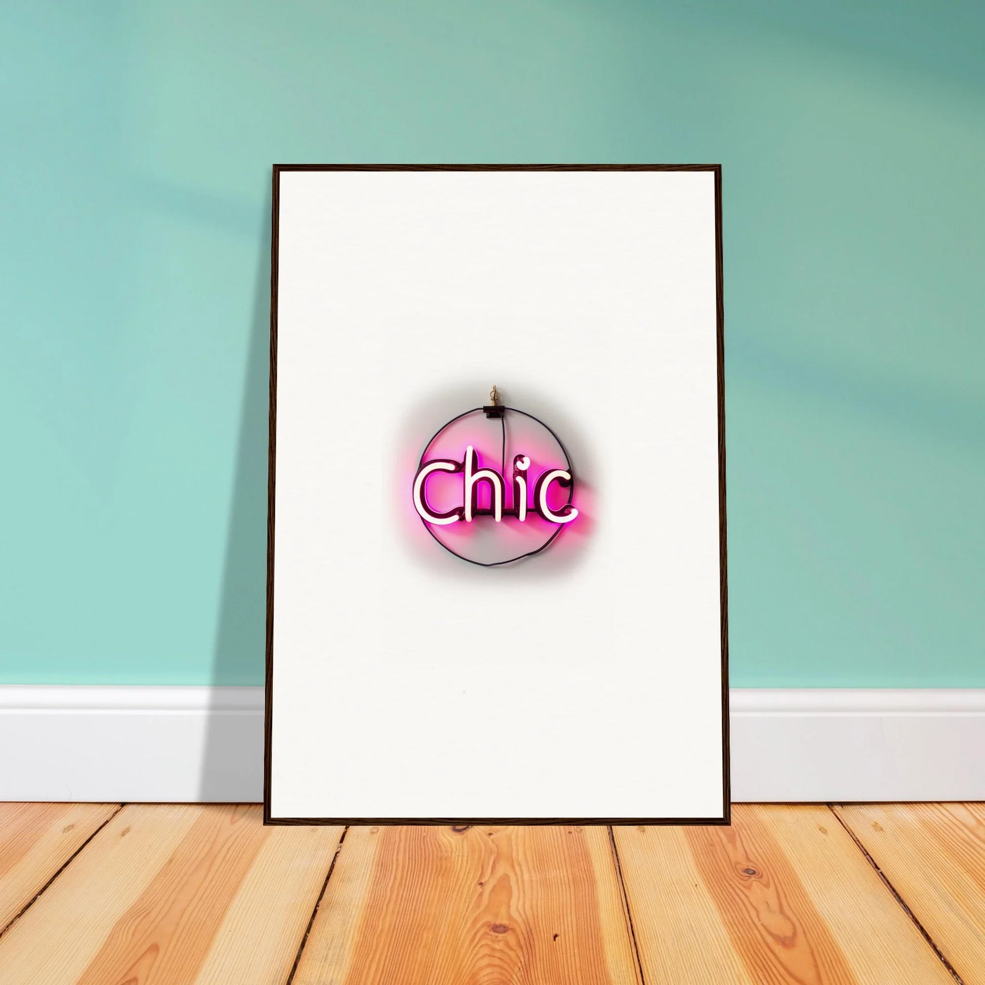 Framed wall art featuring a pink logo with Chic text for stylish room decor