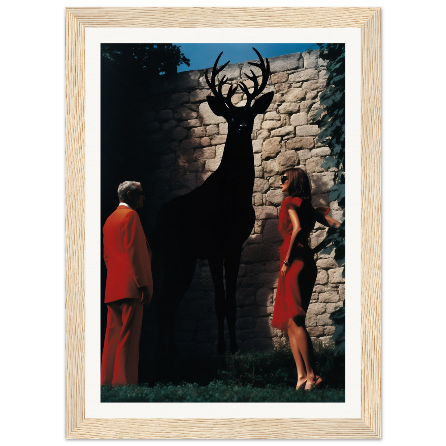 A framed print of a deer and two women