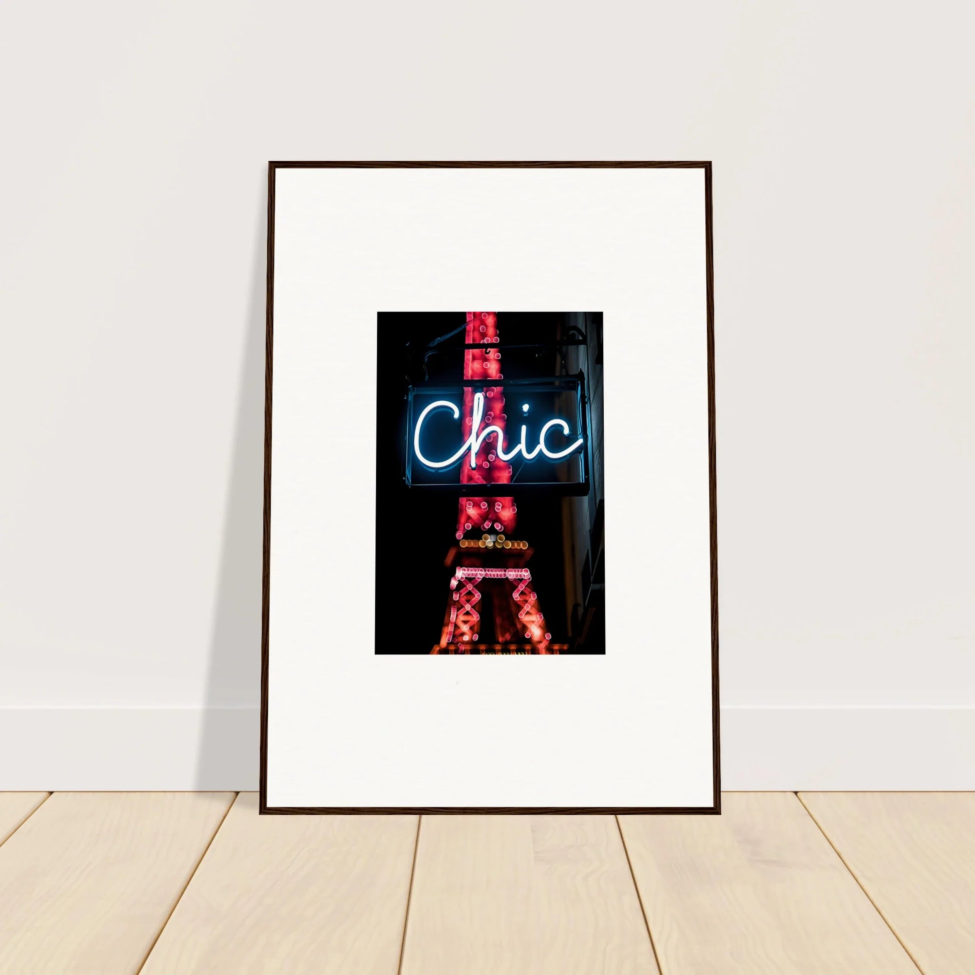 Framed wall art featuring a neon Chic sign over an Eiffel Tower silhouette for Paris dreams